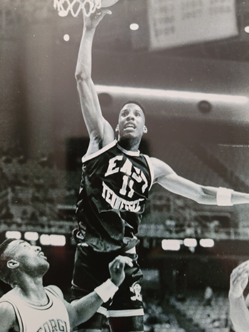 Greg Dennis Dunking a basketball